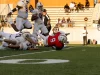 Galveston Ball Dominates Manvel High School in Season Opener at Freedom Field Player jumps over pile, Manvel, Galveston Ball, Football, Varsity Football