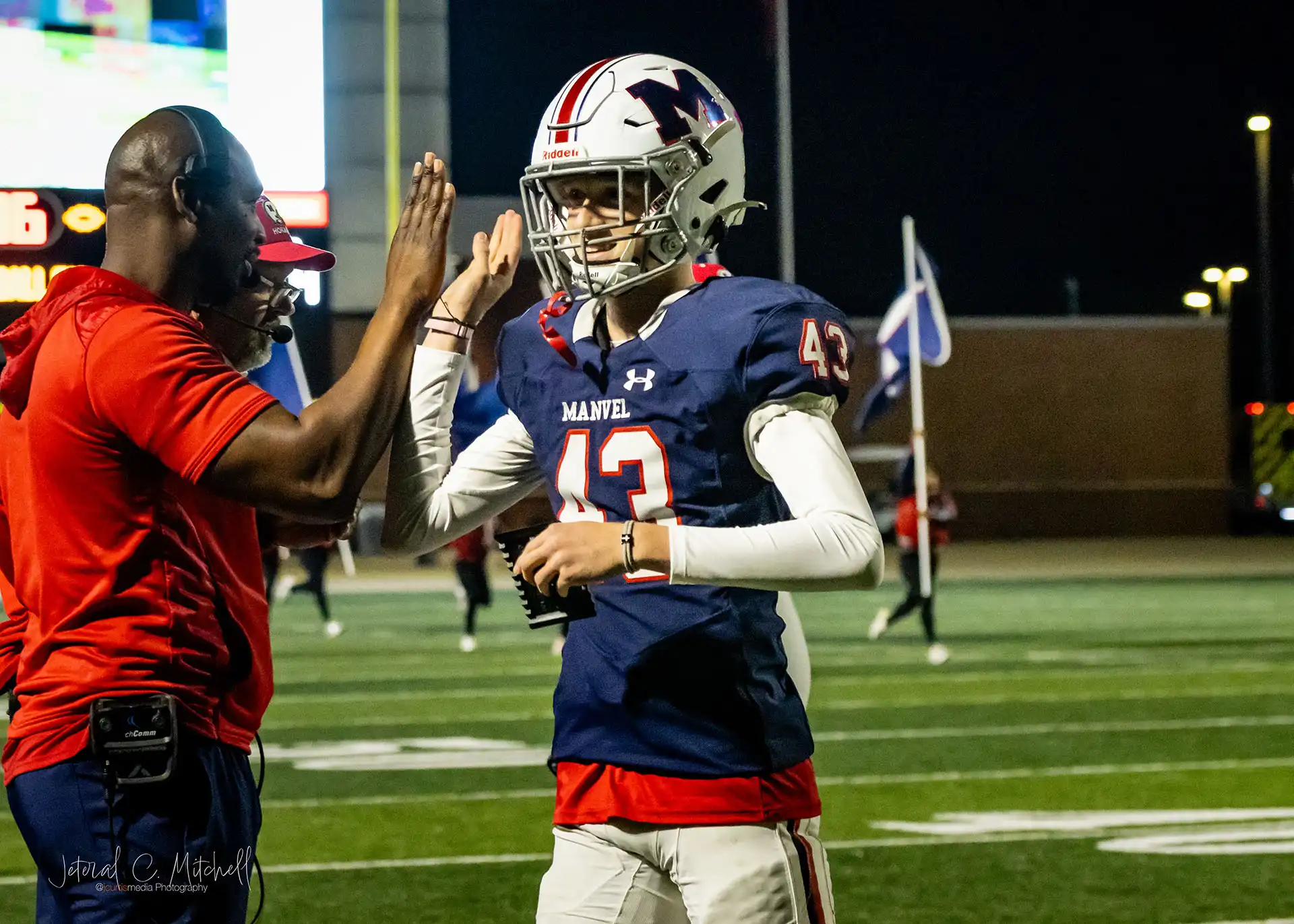 Action shot of Summer Creek Bulldogs vs. Manvel Mavericks in Round 2 Texas high school football playoffs, captured by JCurtisMedia for GameDay Sports Journal,