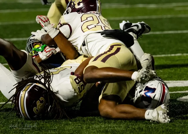 Action shot of Summer Creek Bulldogs vs. Manvel Mavericks in Round 2 Texas high school football playoffs, captured by JCurtisMedia for GameDay Sports Journal