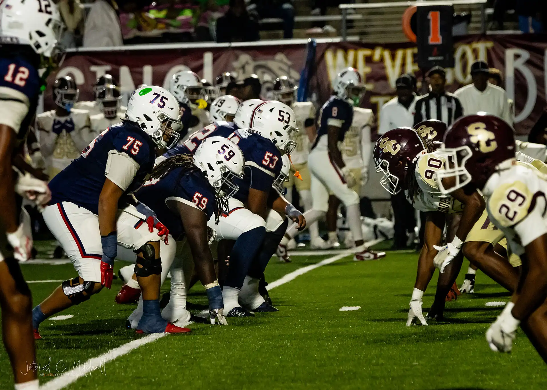 Action shot of Summer Creek Bulldogs vs. Manvel Mavericks in Round 2 Texas high school football playoffs, captured by JCurtisMedia for GameDay Sports Journal, Players lining it up head to head