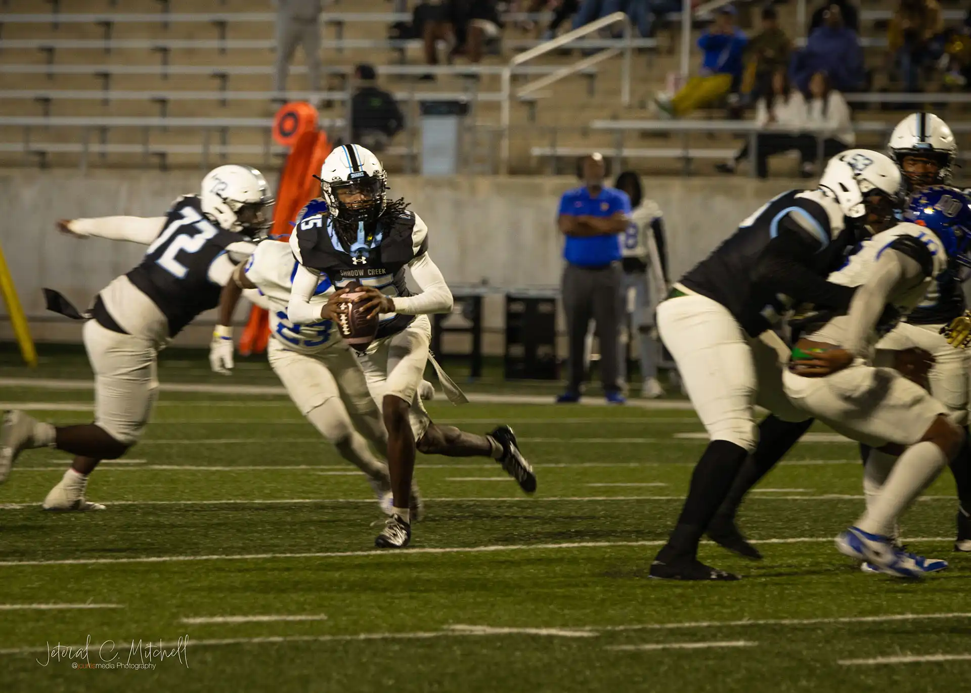 High School Quaterback Rolling out for a pass