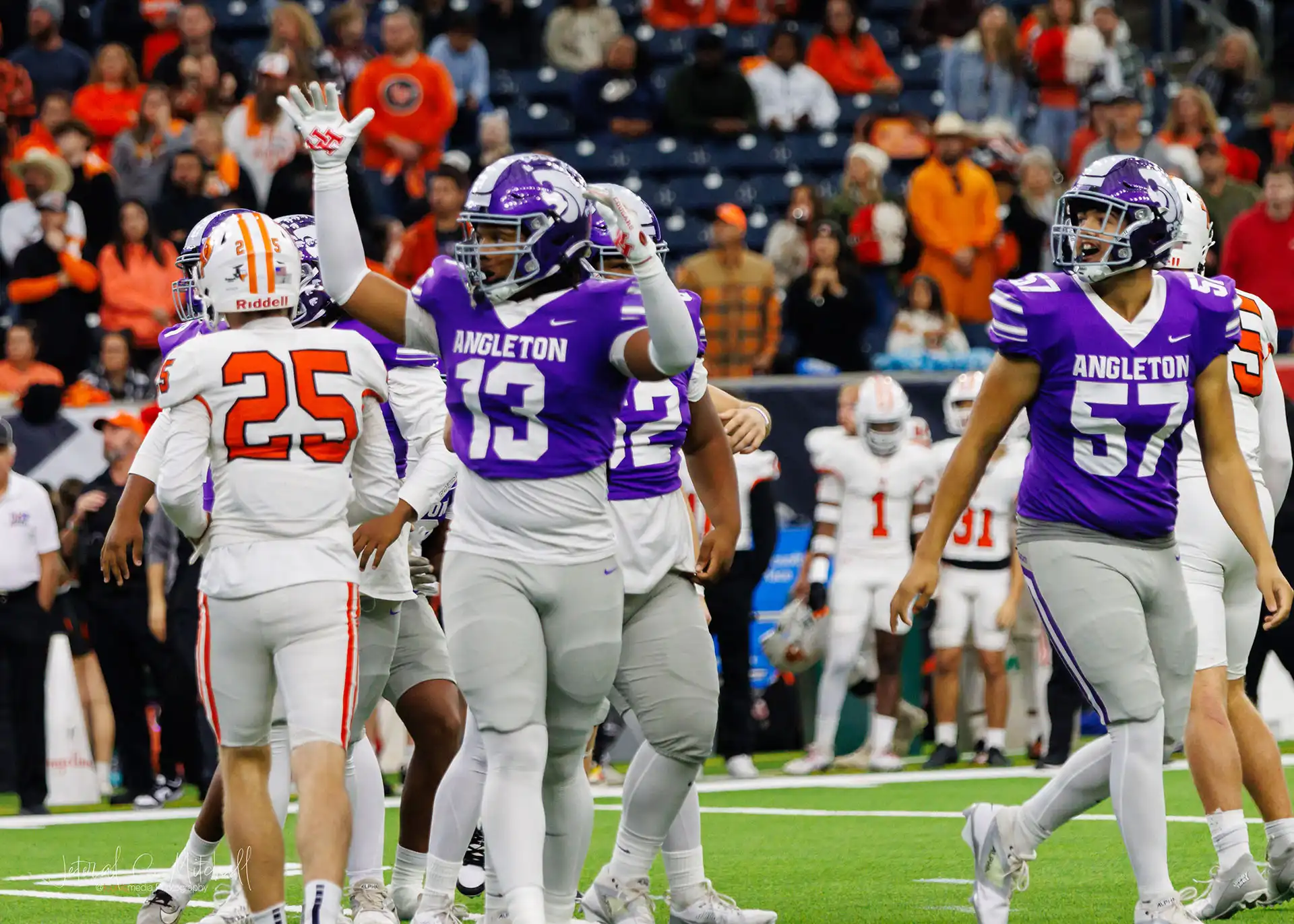 Football players celebrate a successful field goal