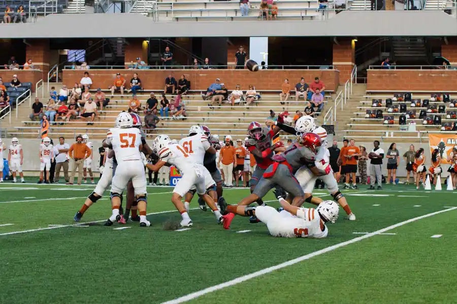 Manvel defense attacks the Alvin offense at Freedom Field