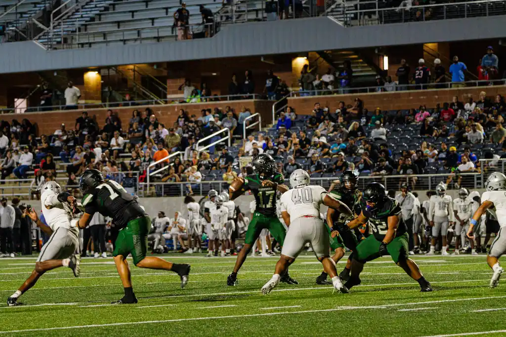 Iowa Colony quarterback looks downfield during passing play
