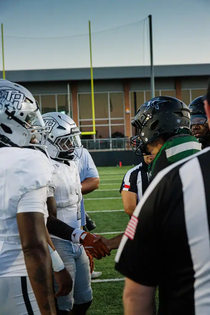Randle and Iowa Colony team representatives meet before the game at Freedom Field