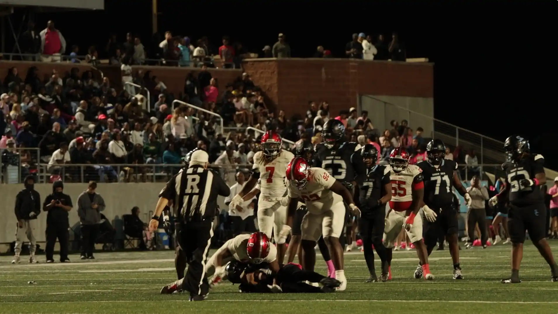 Manvel number 0 completing a sack against Shadow Creek.