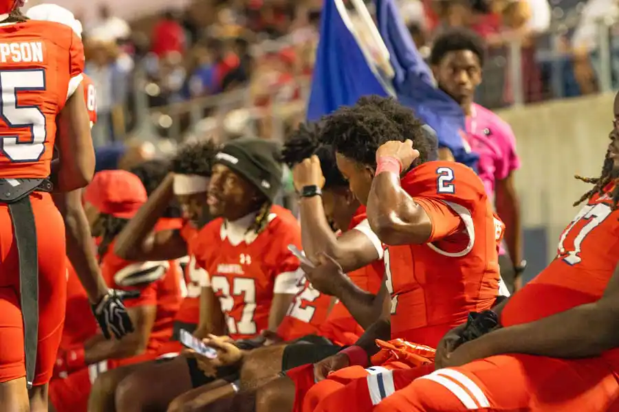 Manvel running back Xaiden Brown with teammates on the sideline